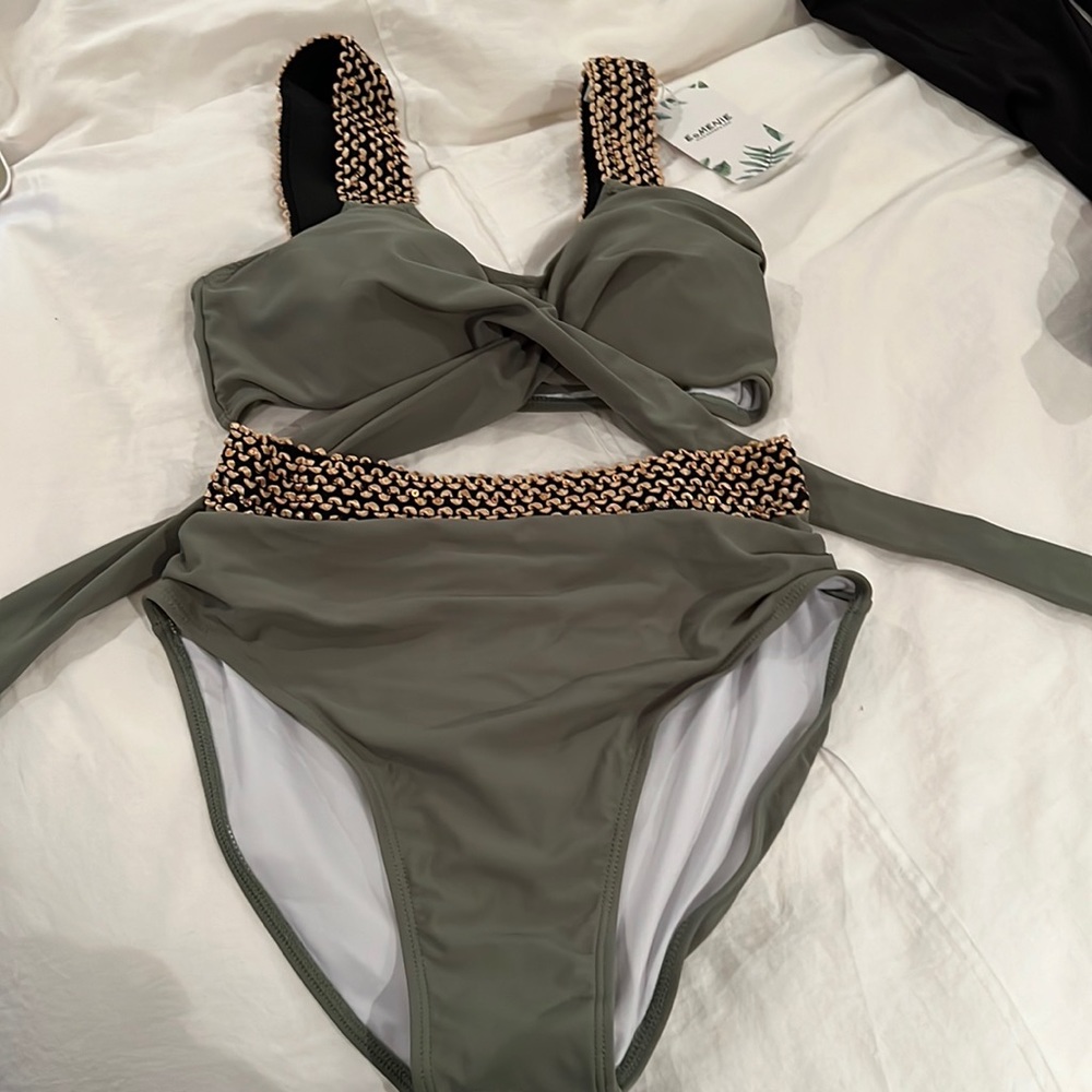 Never worn, tags still on. Olive green two piece bathing suits.